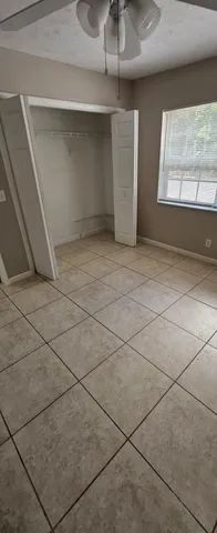 a view of a hallway with windows