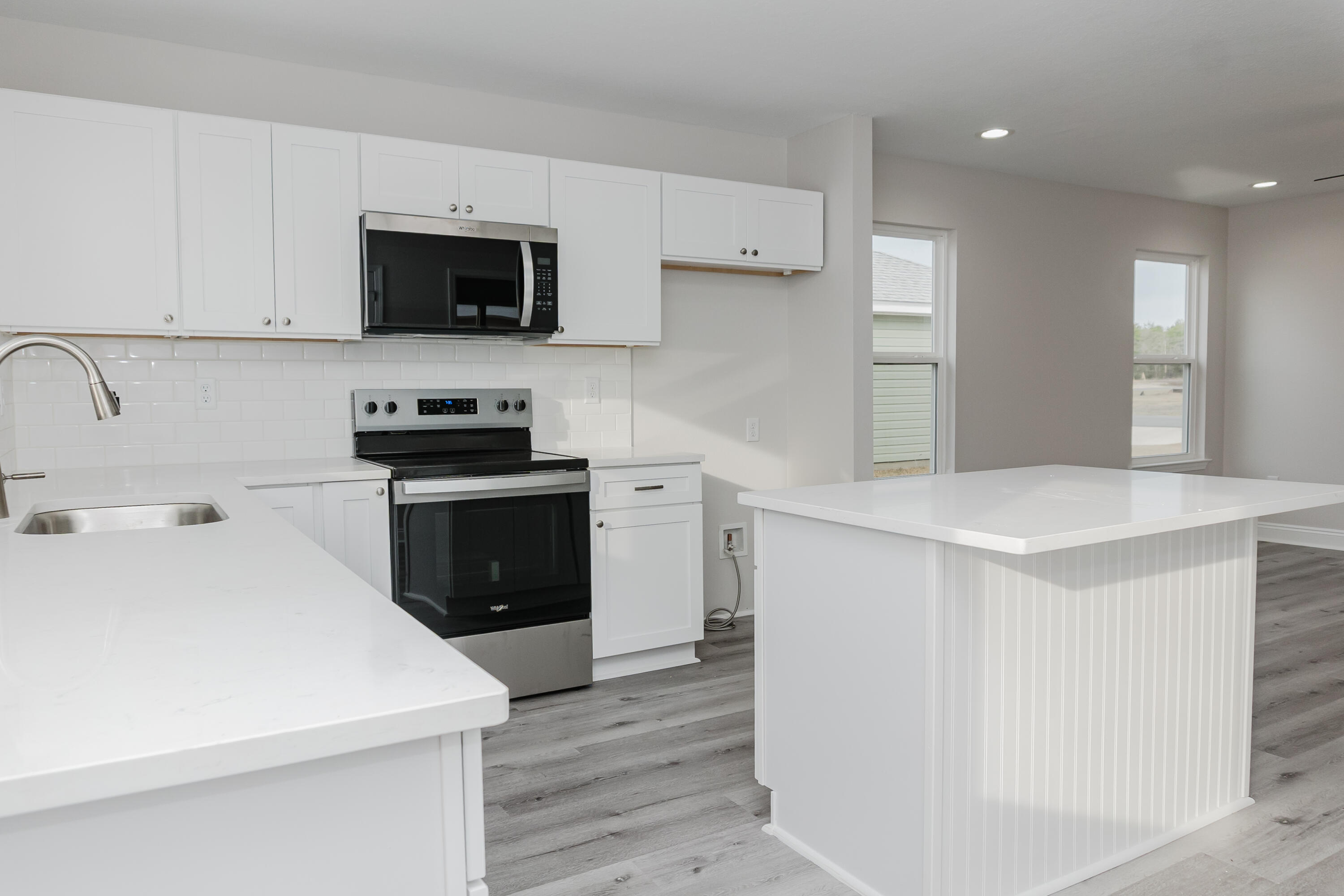 5352 Highview Drive Crestview, FL 32539 - Photo 20 of 32 a kitchen with stainless steel appliances a stove microwave and sink