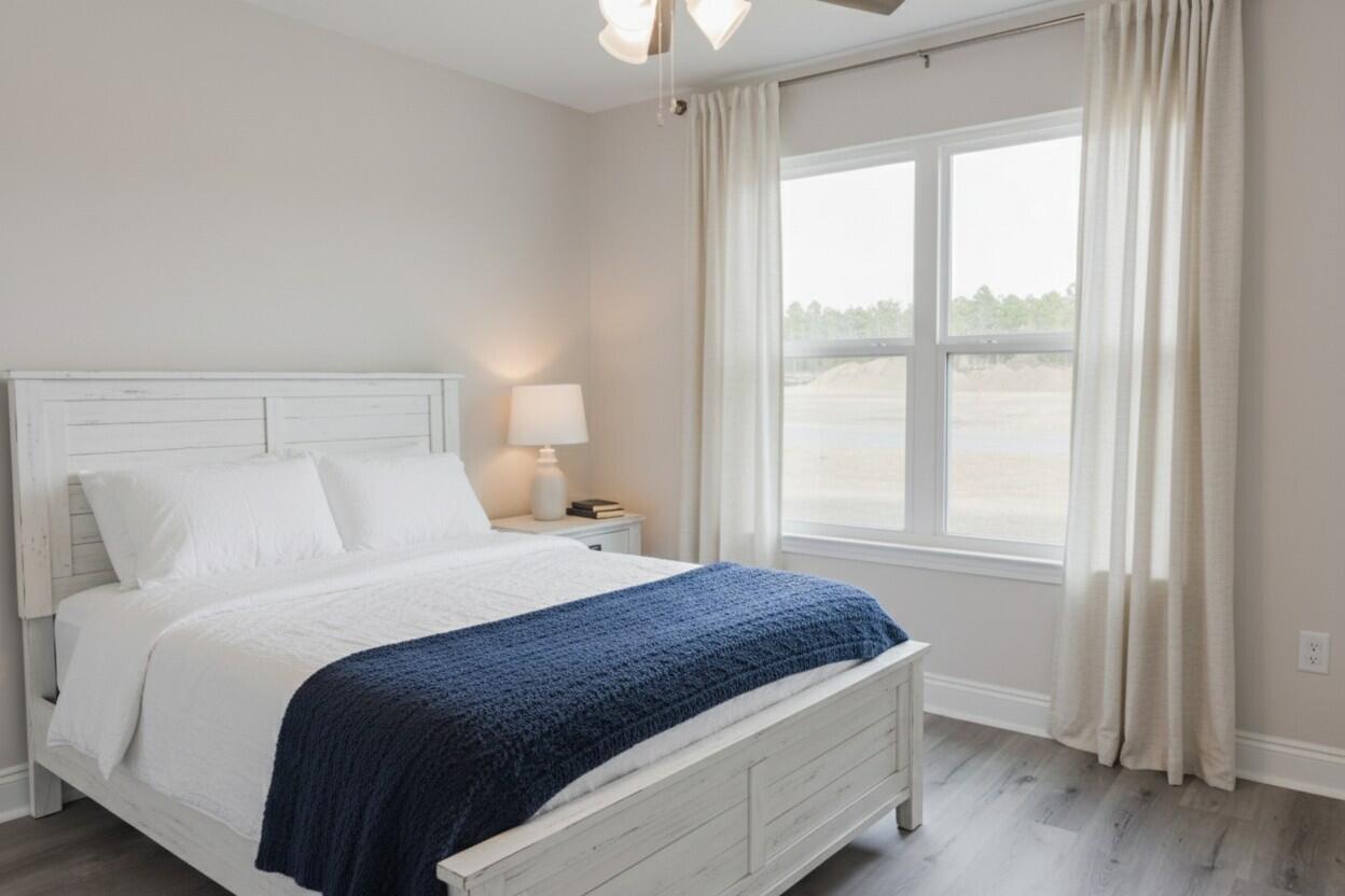 5352 Highview Drive Crestview, FL 32539 - Photo 4 of 32 a bedroom with a large bed and a large window