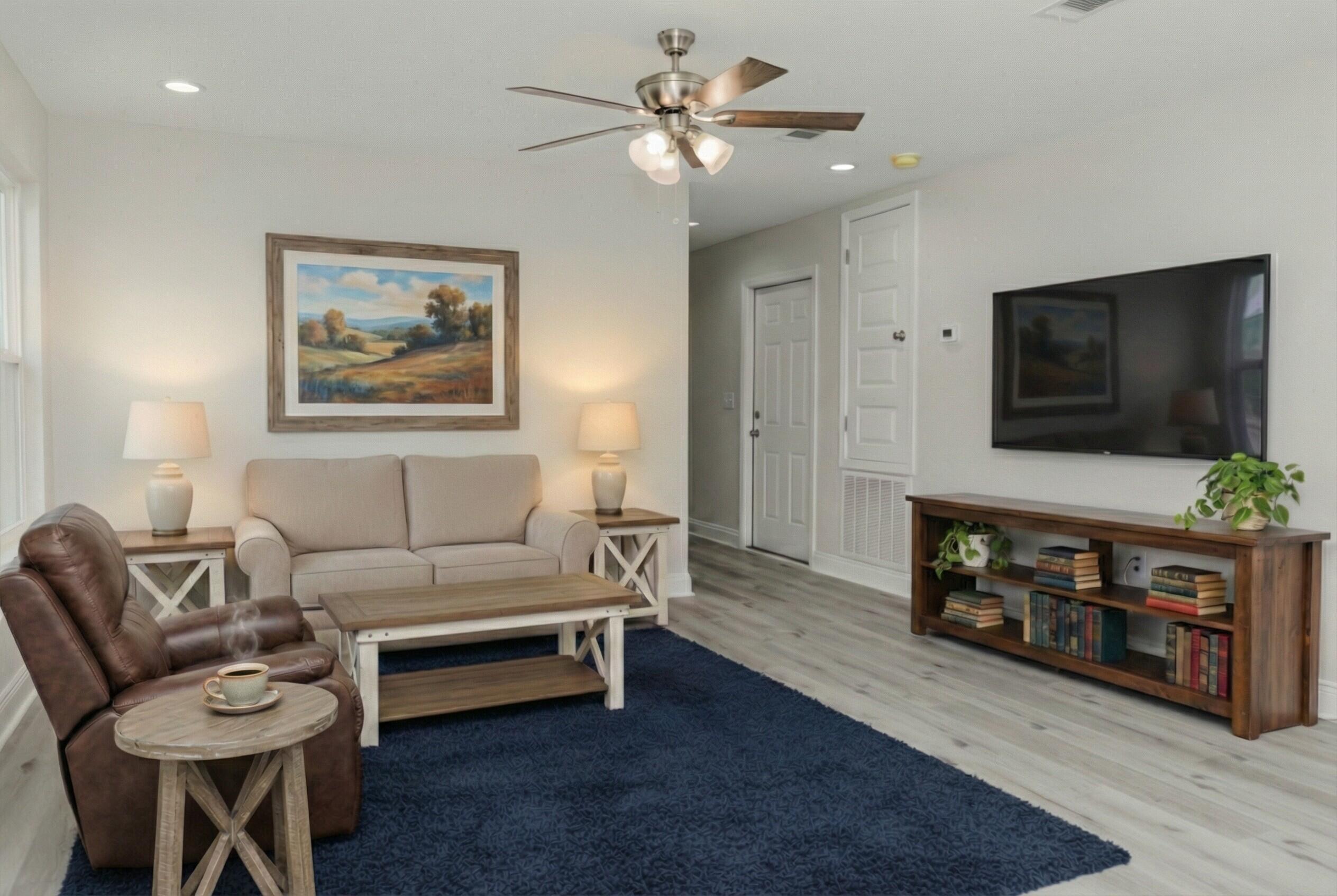 5352 Highview Drive Crestview, FL 32539 - Photo 9 of 32 a living room with furniture and a flat screen tv