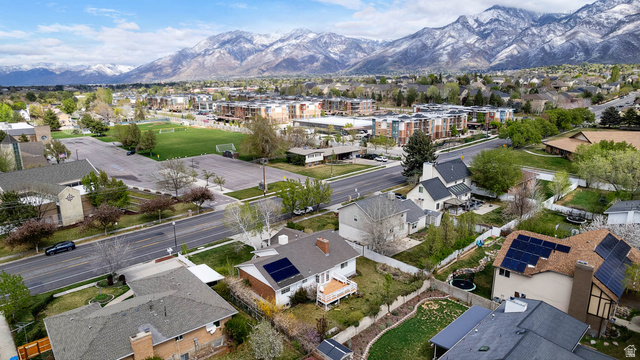 1822 East 9800th Street South Sandy, UT 84092 - Photo 13 of 38 Aerial view of property and surrounding area featuring nearby suburban area and mountains
