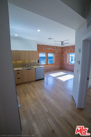 a view of kitchen and wooden floor