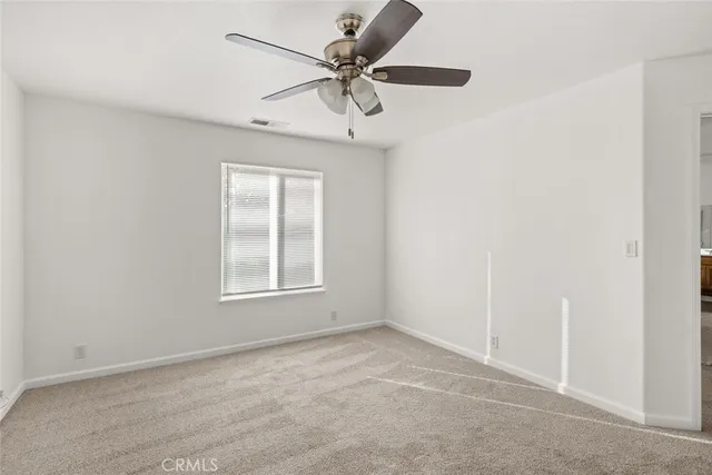 a view of a livingroom with a ceiling fan