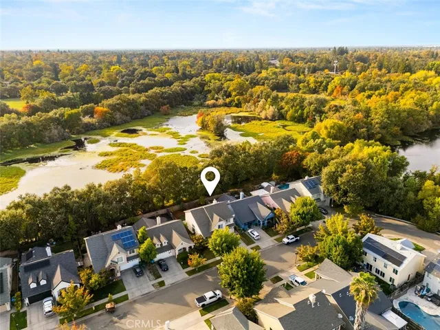 an aerial view of residential houses with outdoor space