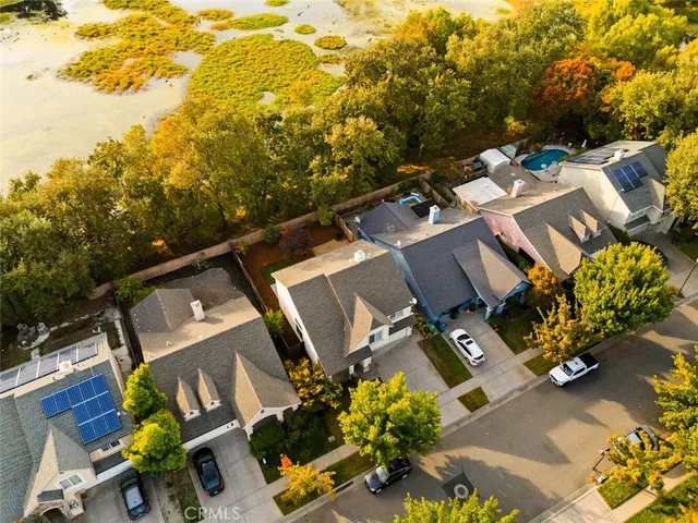an aerial view of residential house with outdoor space and parking