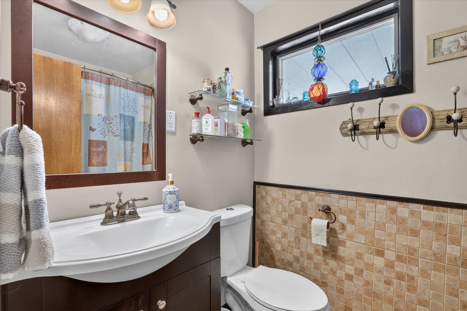 1204 West Violet Street Freeport, IL 61032 - Photo 28 of 36 a bathroom with a sink mirror and toilet