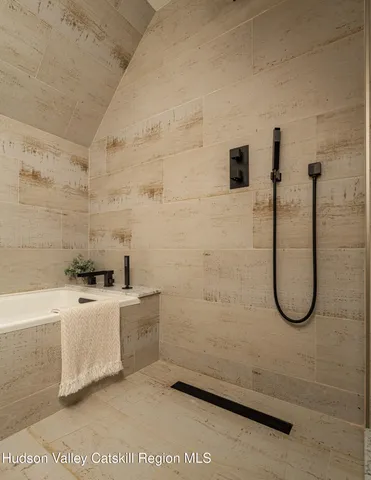 a view of a patio with dining table and chairs with wooden floor