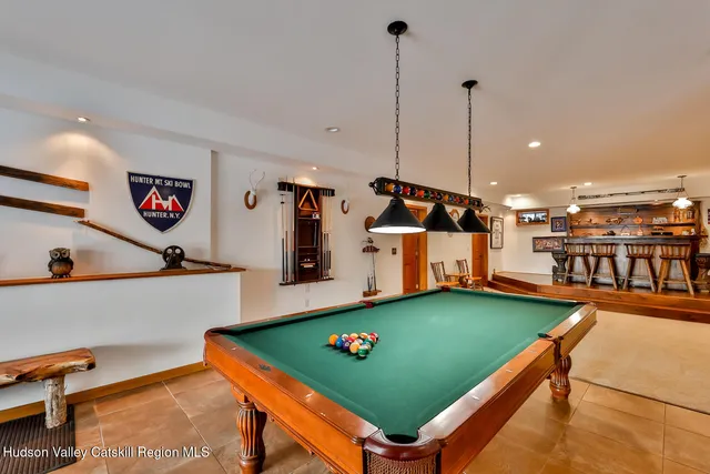 a front view of a house with snow on the road