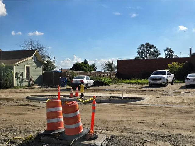 a view of a lake with lawn chairs