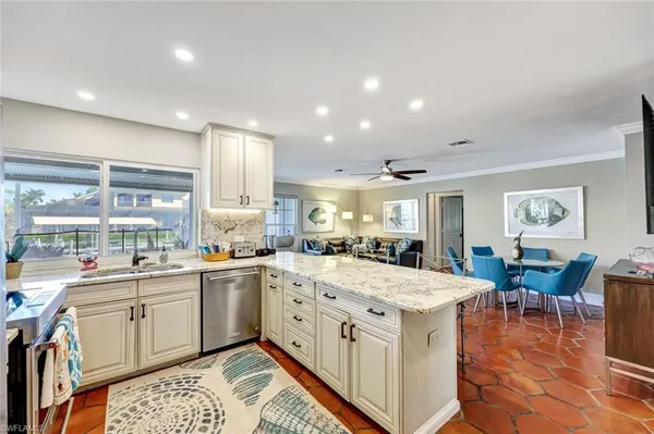 a kitchen with a sink stove and wooden cabinets