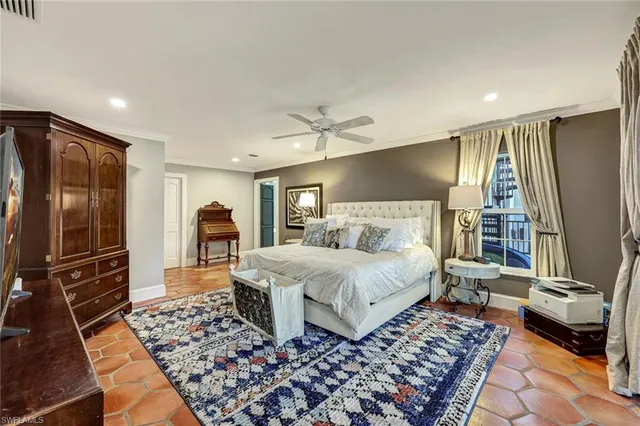 a spacious bedroom with a bed and a walk in closet