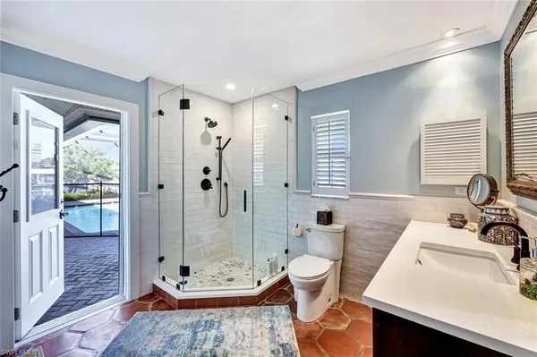 a spacious bathroom with a double vanity sink toilet and shower