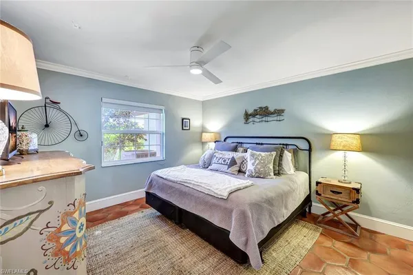 a bedroom with a bed and a table in it