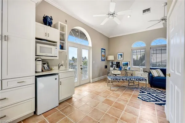 a living room with furniture a table and decor