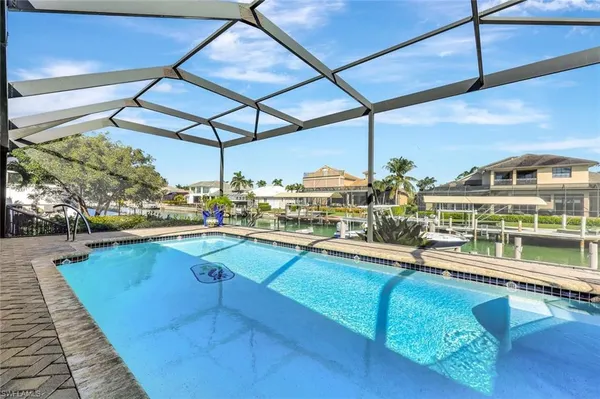 a view of swimming pool with outdoor seating