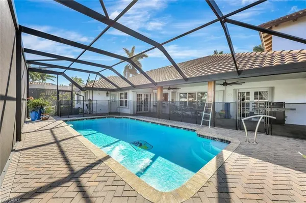 a view of swimming pool with seating space