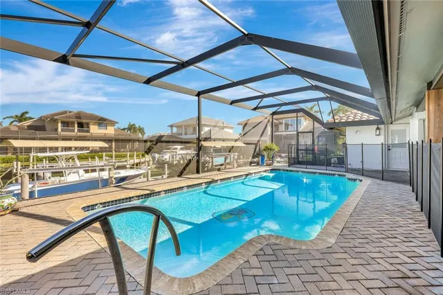 a view of a swimming pool with a patio