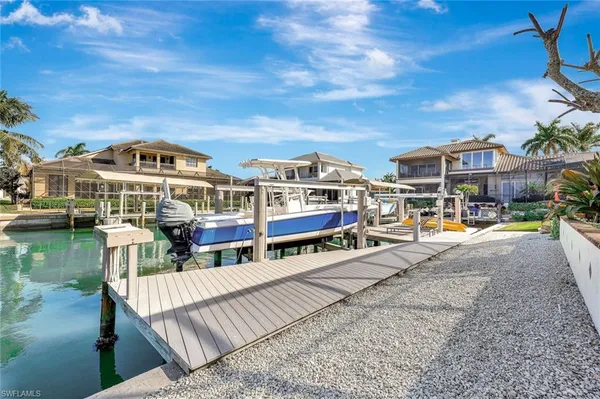 a view of multiple houses with a lake view