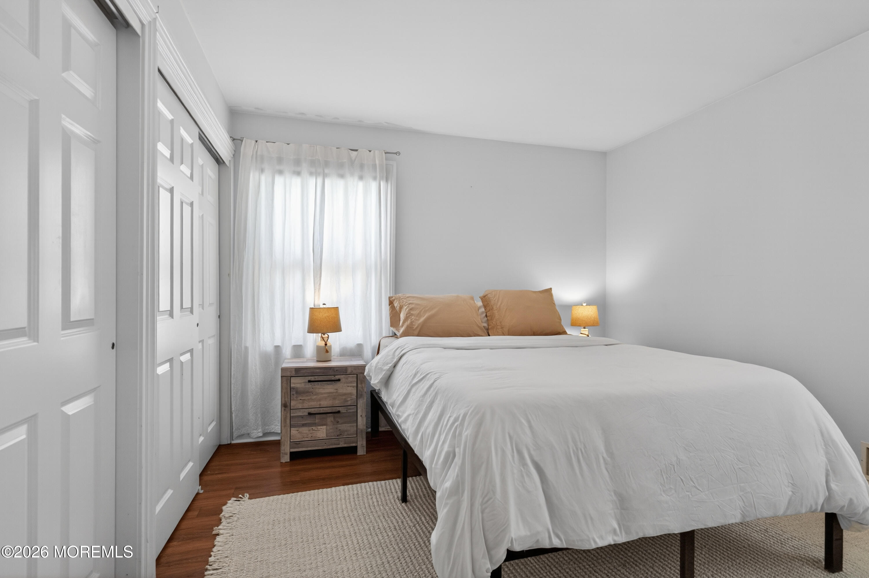 65 Heck Avenue Ocean Grove, NJ 07756 - Photo 27 of 37 a bedroom with a bed and a window