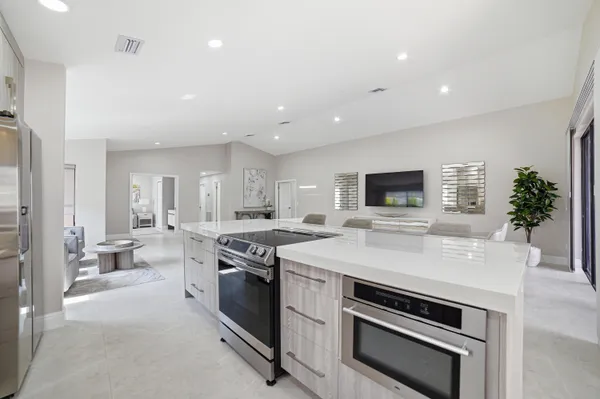 a spacious bathroom with a bathtub sink and mirror