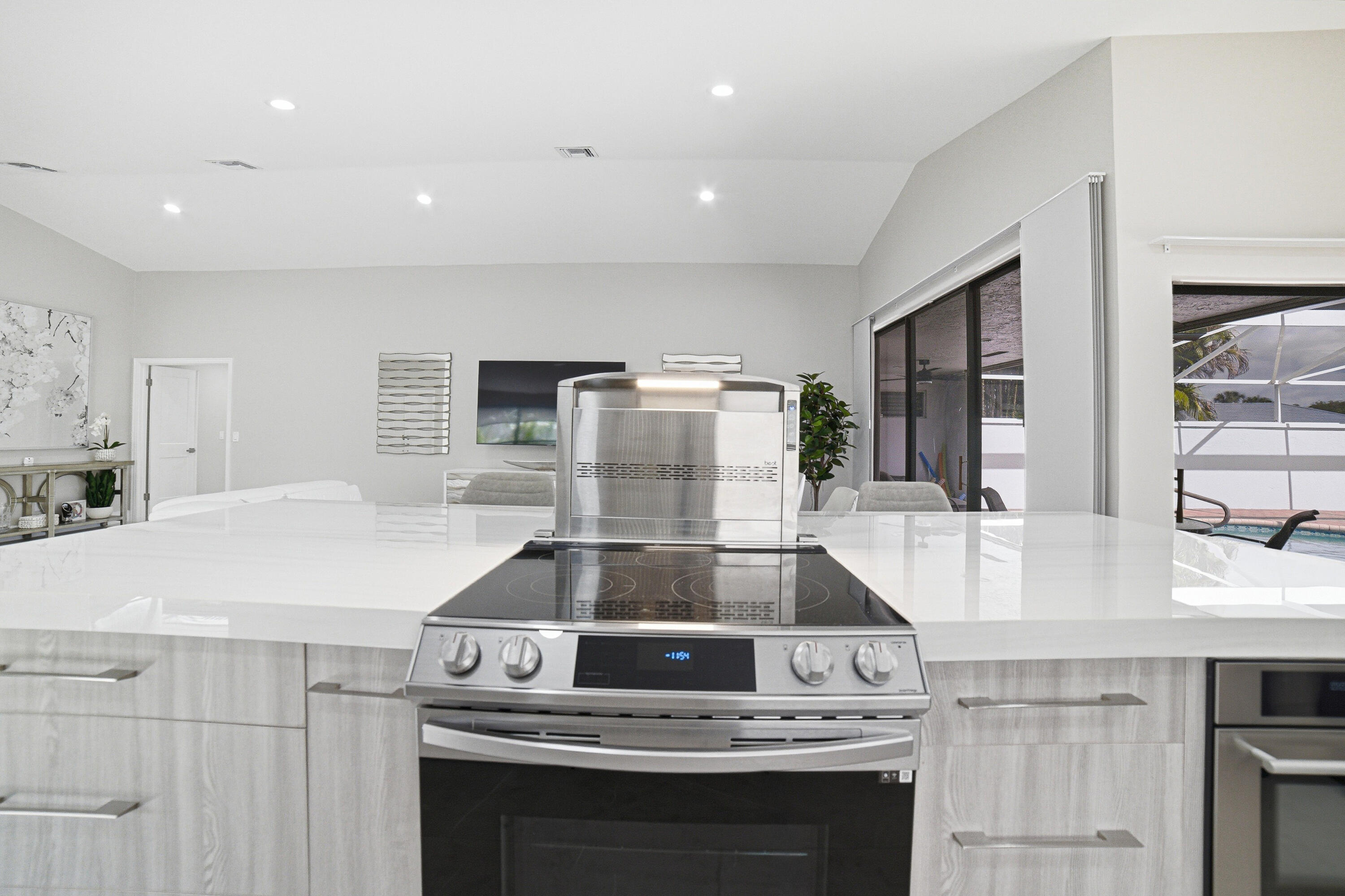 10861 White Aspen Lane Boca Raton, FL 33428 - Photo 18 of 70 a kitchen with a stove and a microwave