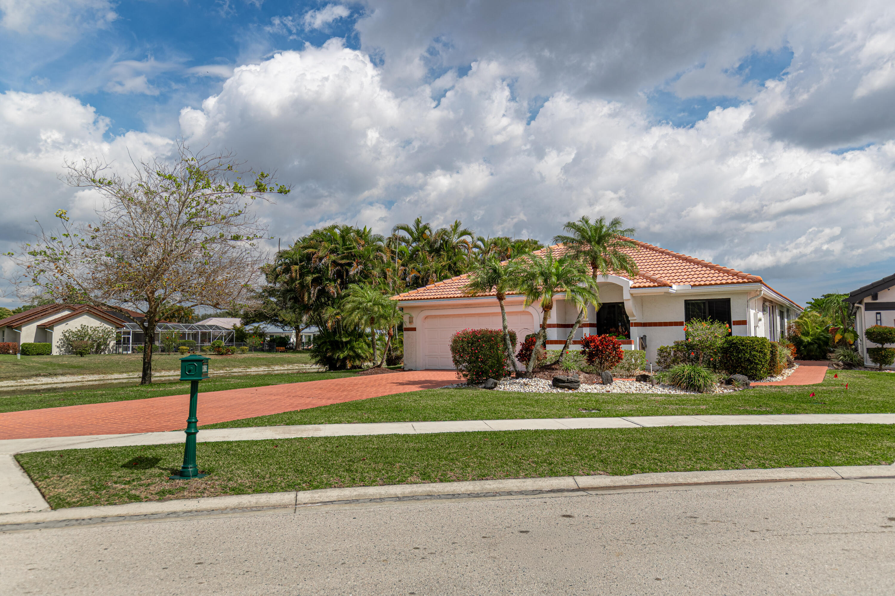 10861 White Aspen Lane Boca Raton, FL 33428 - Photo 2 of 70 a front view of house with yard and green space