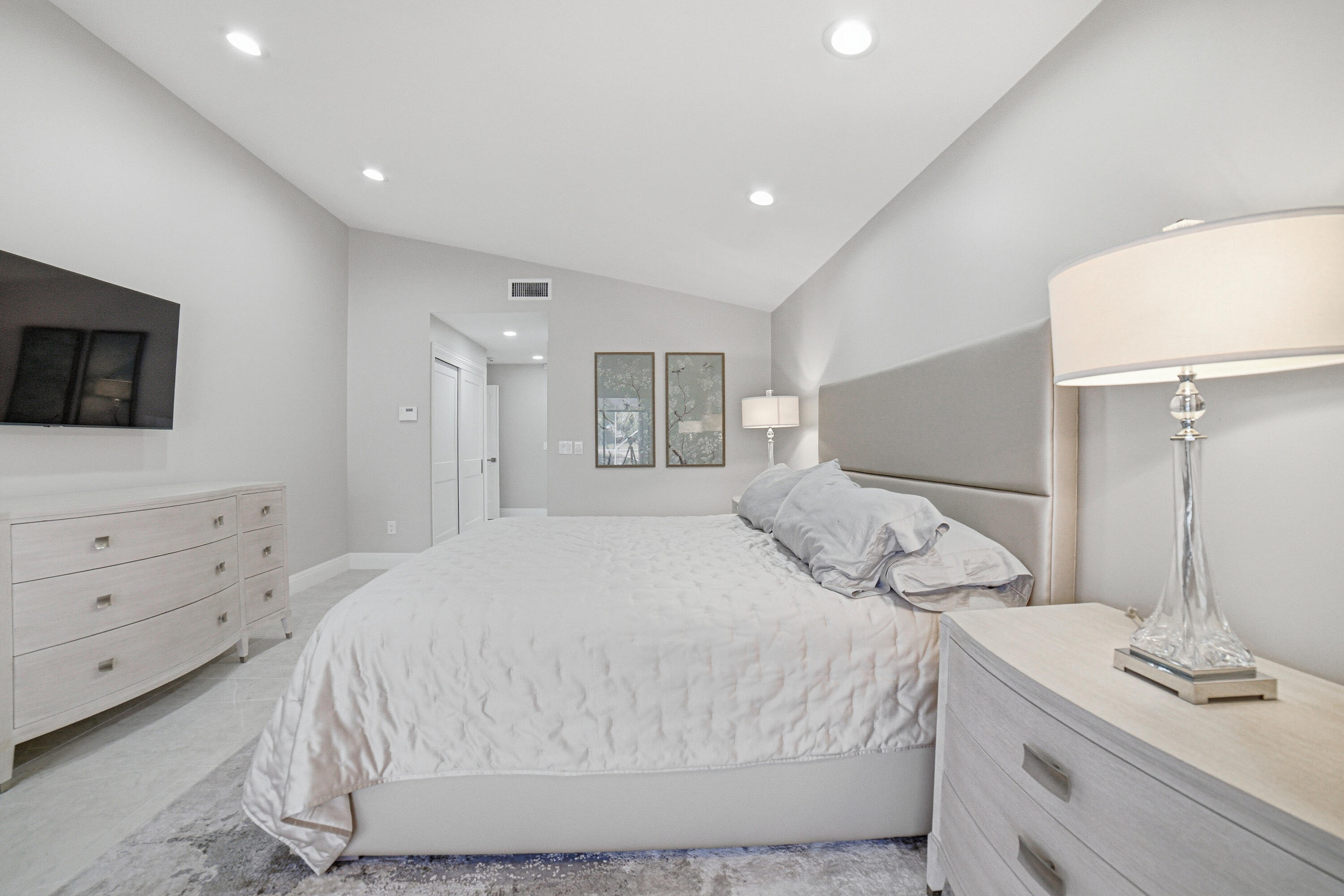 10861 White Aspen Lane Boca Raton, FL 33428 - Photo 22 of 70 a bedroom with a bed and a flat screen tv