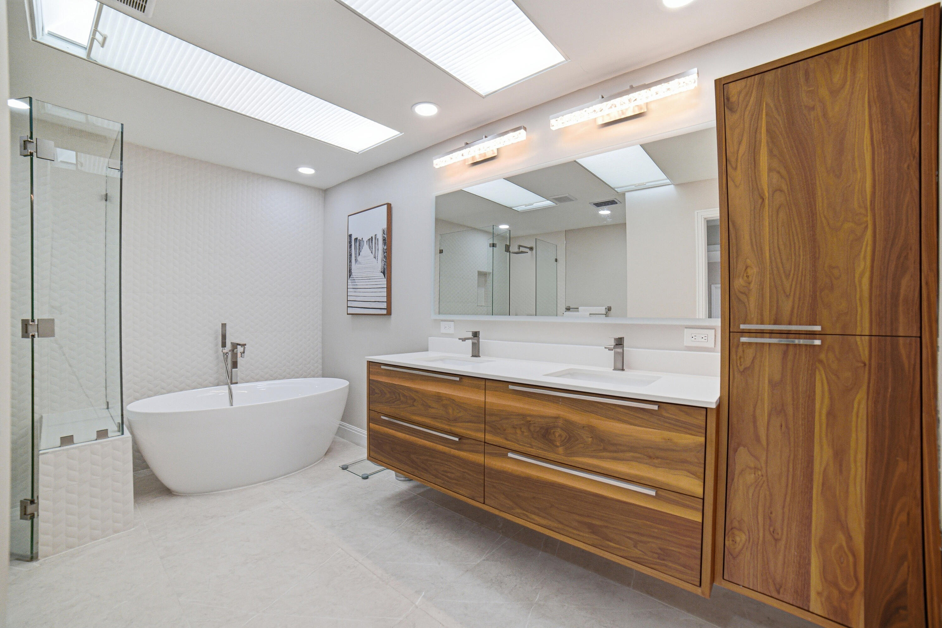 10861 White Aspen Lane Boca Raton, FL 33428 - Photo 23 of 70 a spacious bathroom with a bathtub sink and mirror