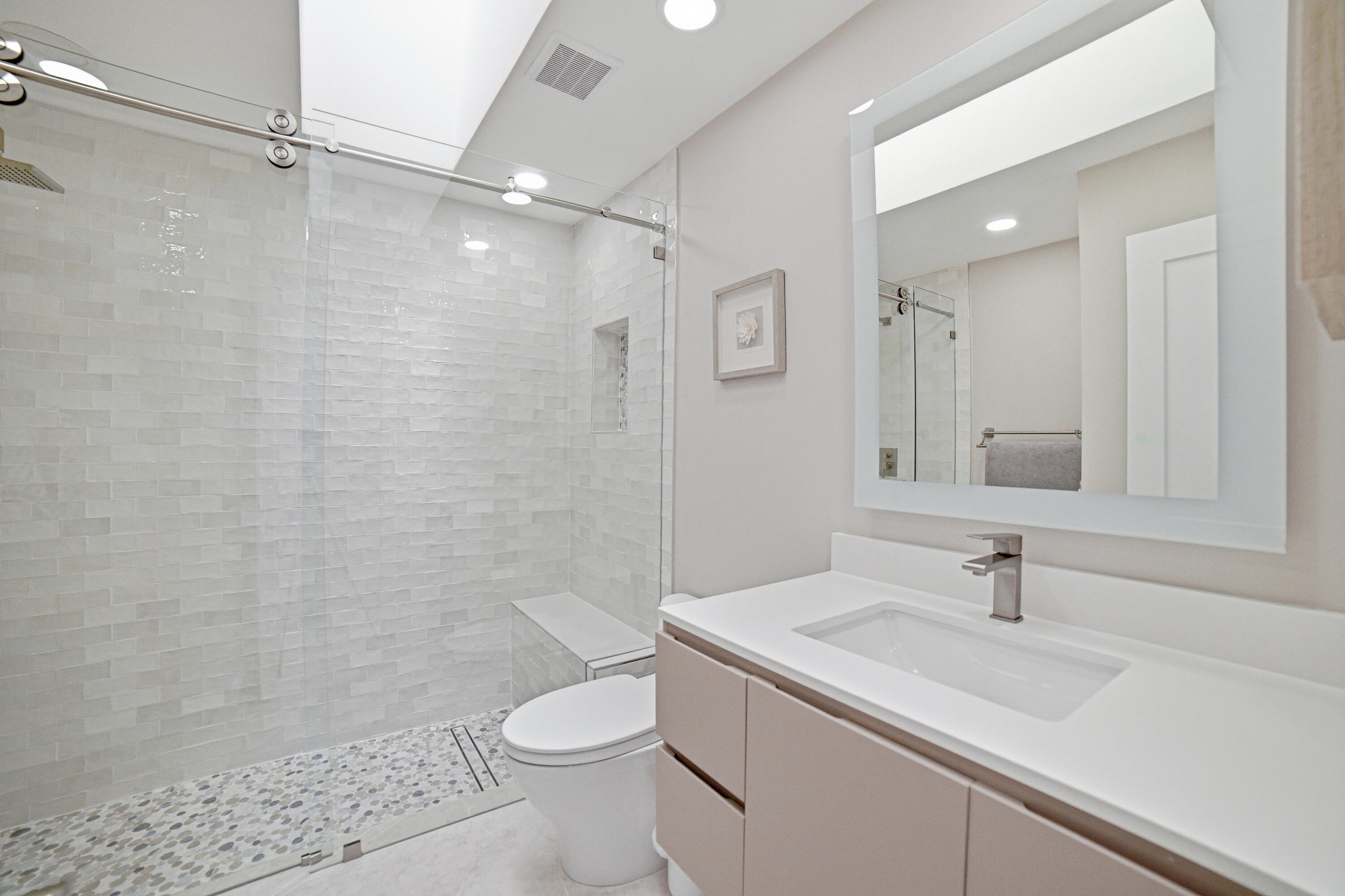 10861 White Aspen Lane Boca Raton, FL 33428 - Photo 27 of 70 a bathroom with a sink a toilet and shower