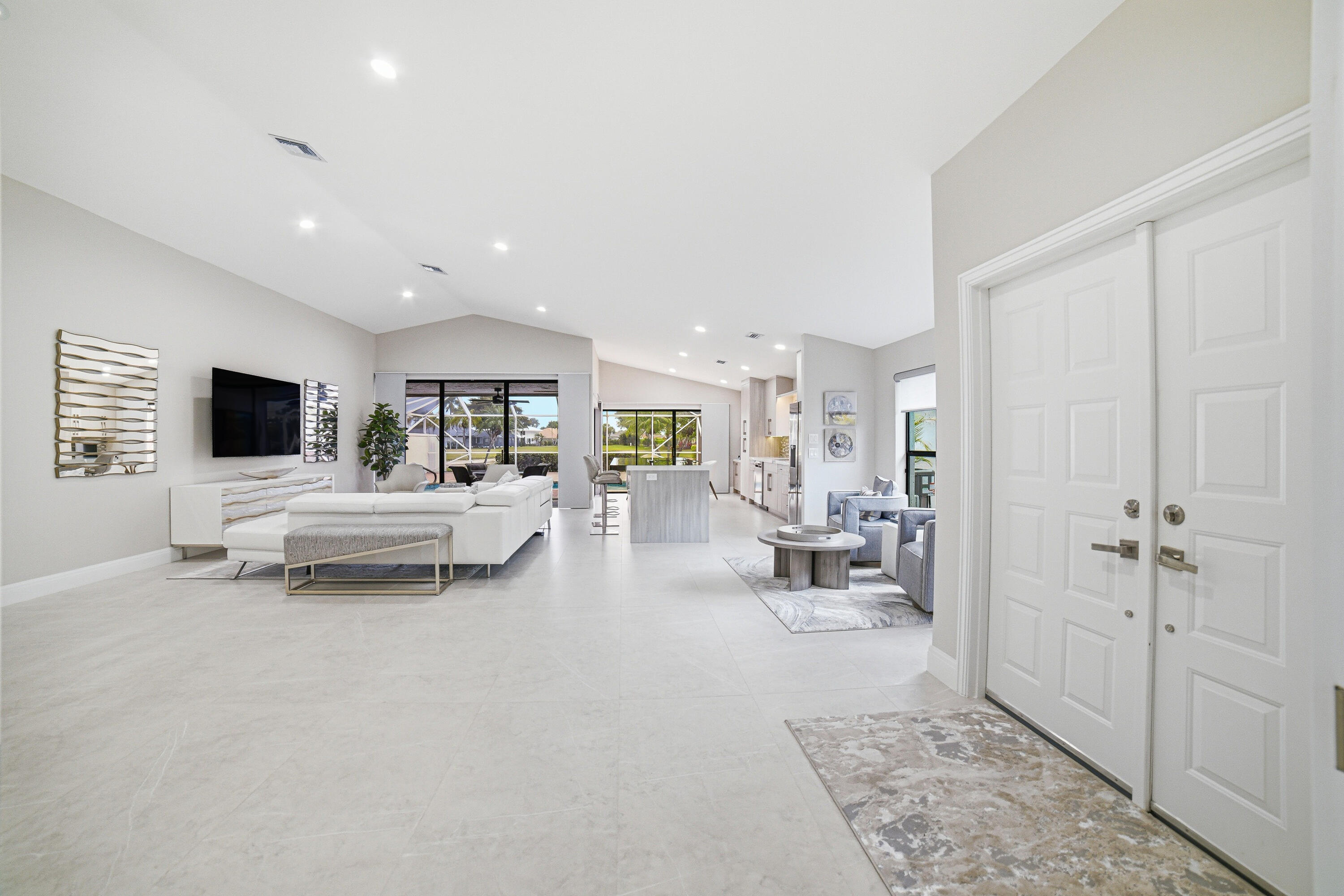 10861 White Aspen Lane Boca Raton, FL 33428 - Photo 3 of 70 a living room with furniture and a flat screen tv