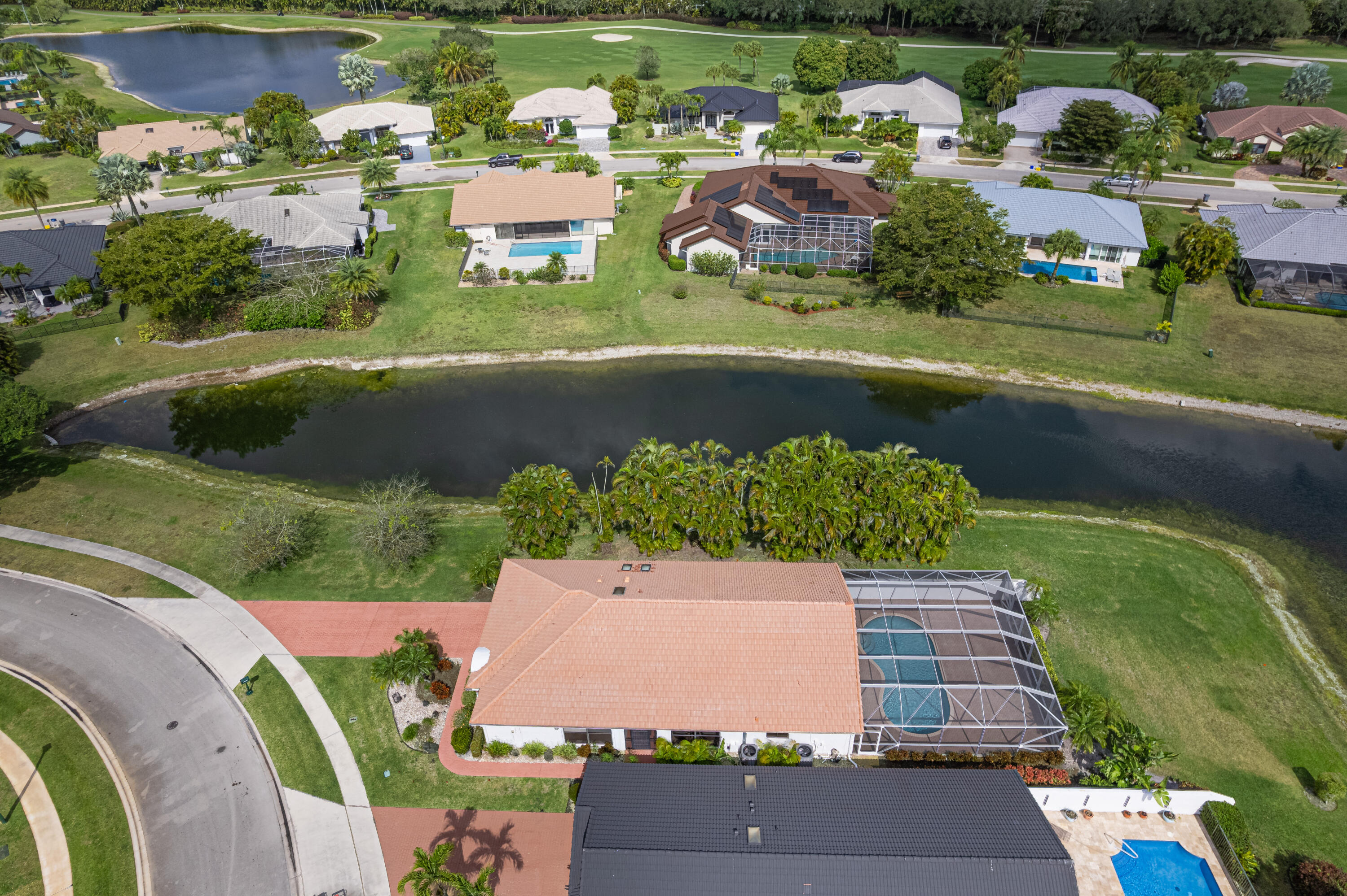 10861 White Aspen Lane Boca Raton, FL 33428 - Photo 34 of 70 an aerial view of a house with a garden and lake view