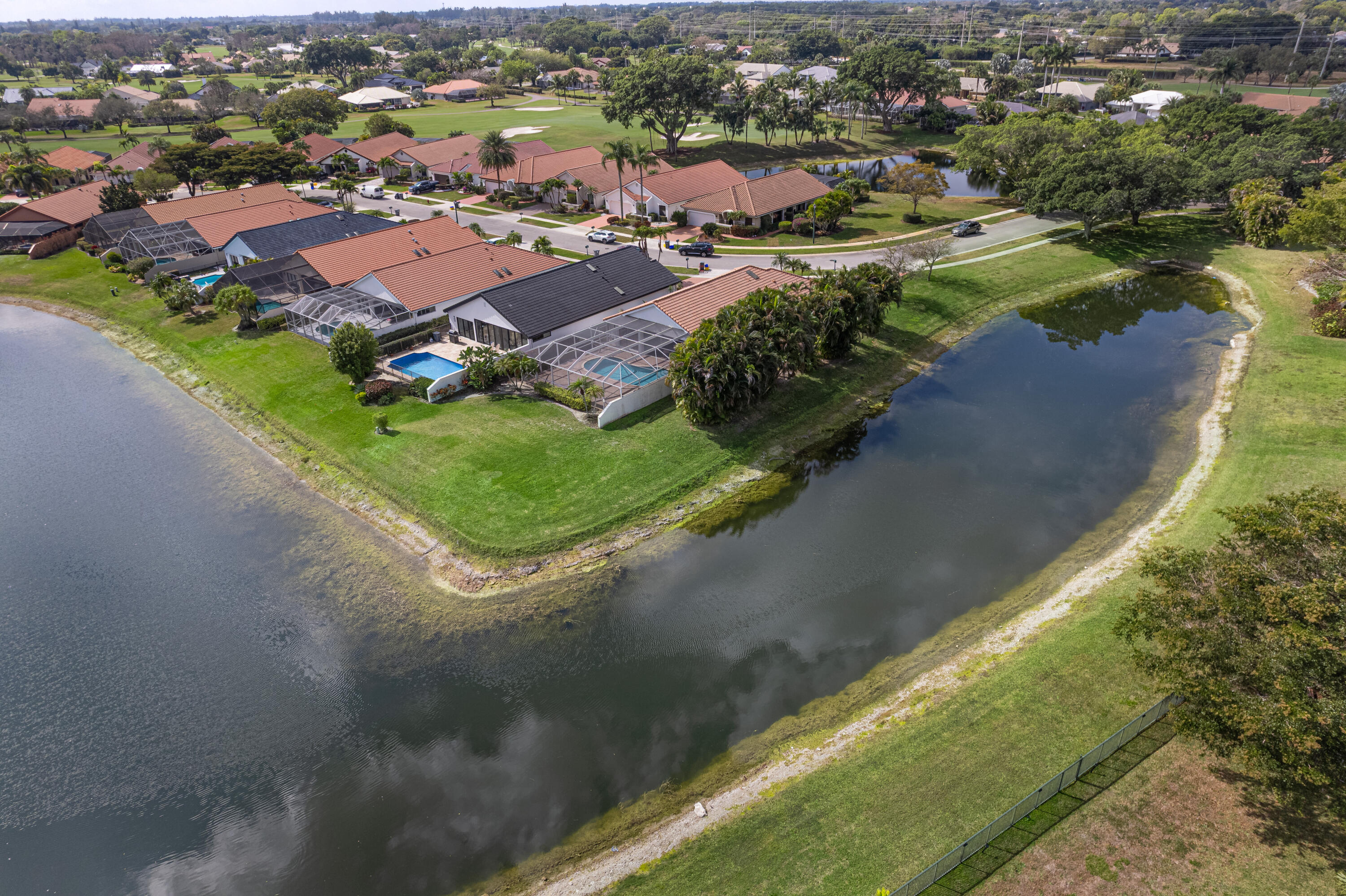 10861 White Aspen Lane Boca Raton, FL 33428 - Photo 35 of 70 an aerial view of residential houses with outdoor space and river