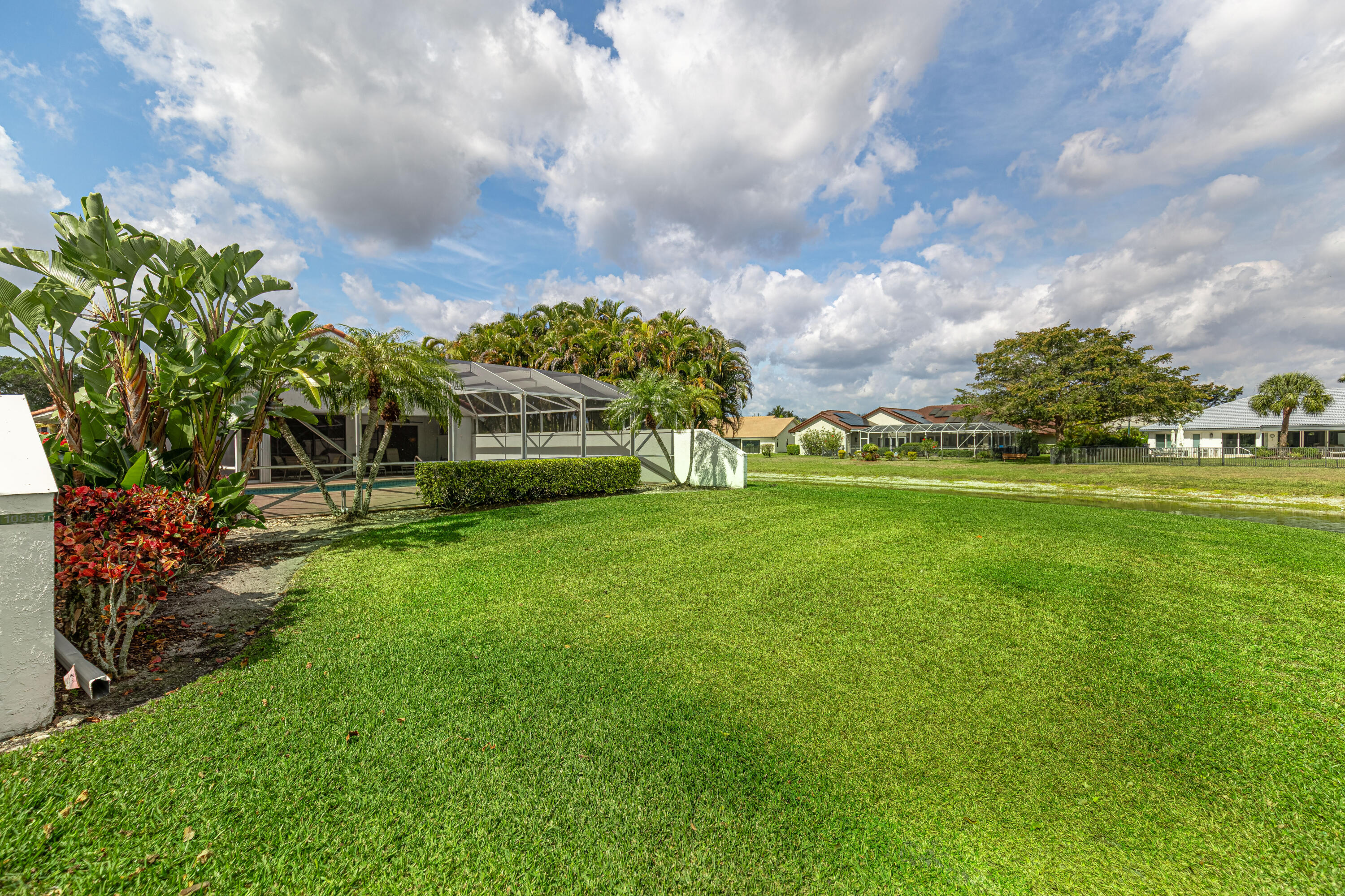 10861 White Aspen Lane Boca Raton, FL 33428 - Photo 48 of 70 a view of a house with a big yard and a large tree