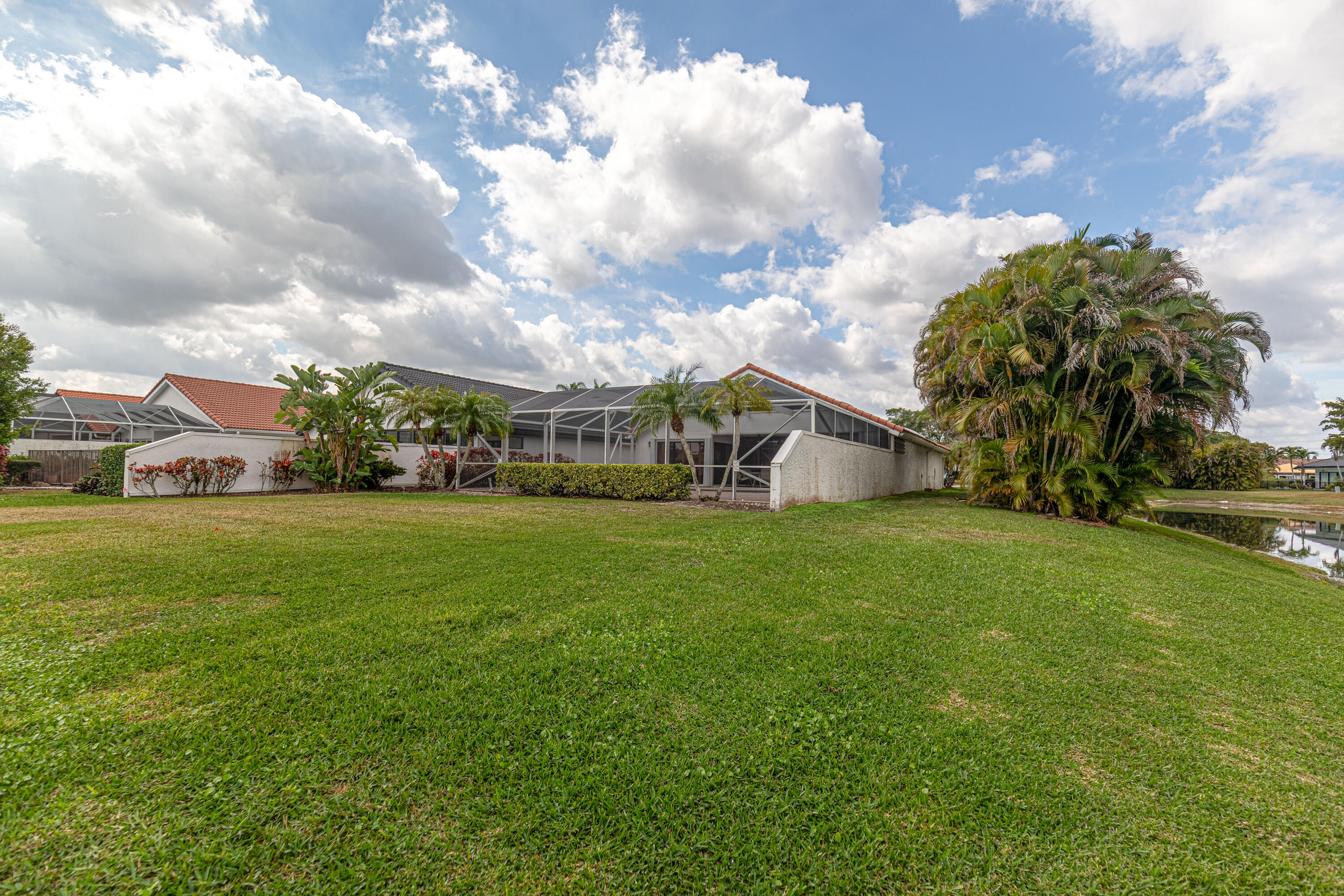 10861 White Aspen Lane Boca Raton, FL 33428 - Photo 50 of 70 a view of house with garden space and car parked