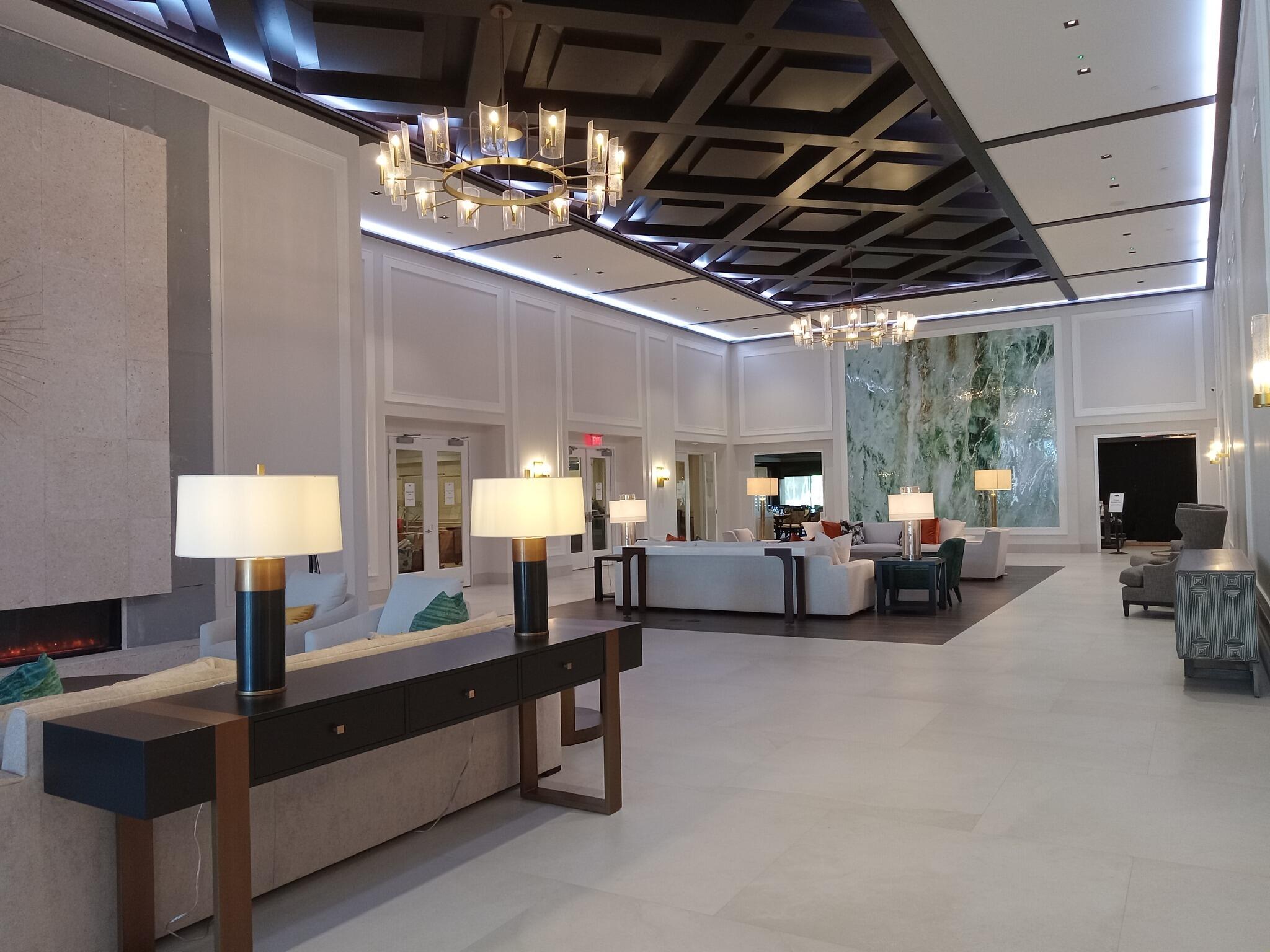 10861 White Aspen Lane Boca Raton, FL 33428 - Photo 67 of 70 a living room with furniture and a chandelier