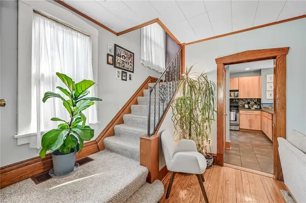 a living room filled with furniture and potted plant
