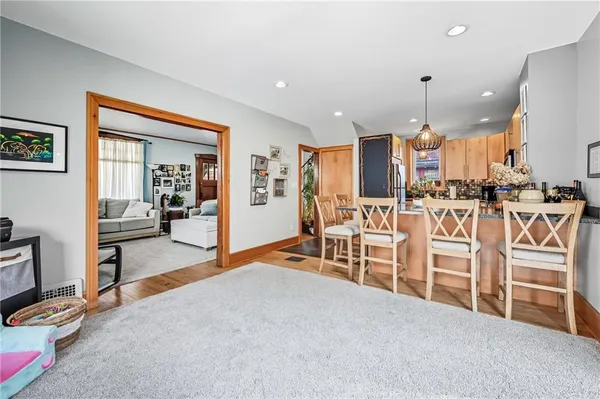 a view of a kitchen with dining table and chairs