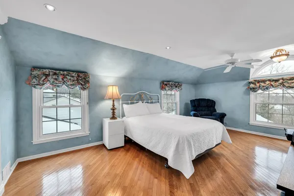 a bedroom with a bed and window