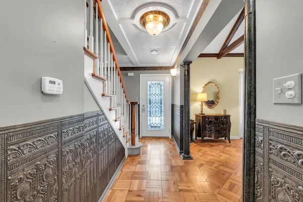 a view of hall way with furniture