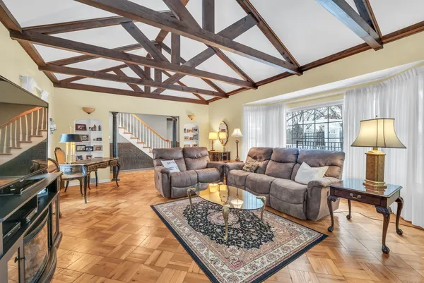 a living room with furniture and a rug