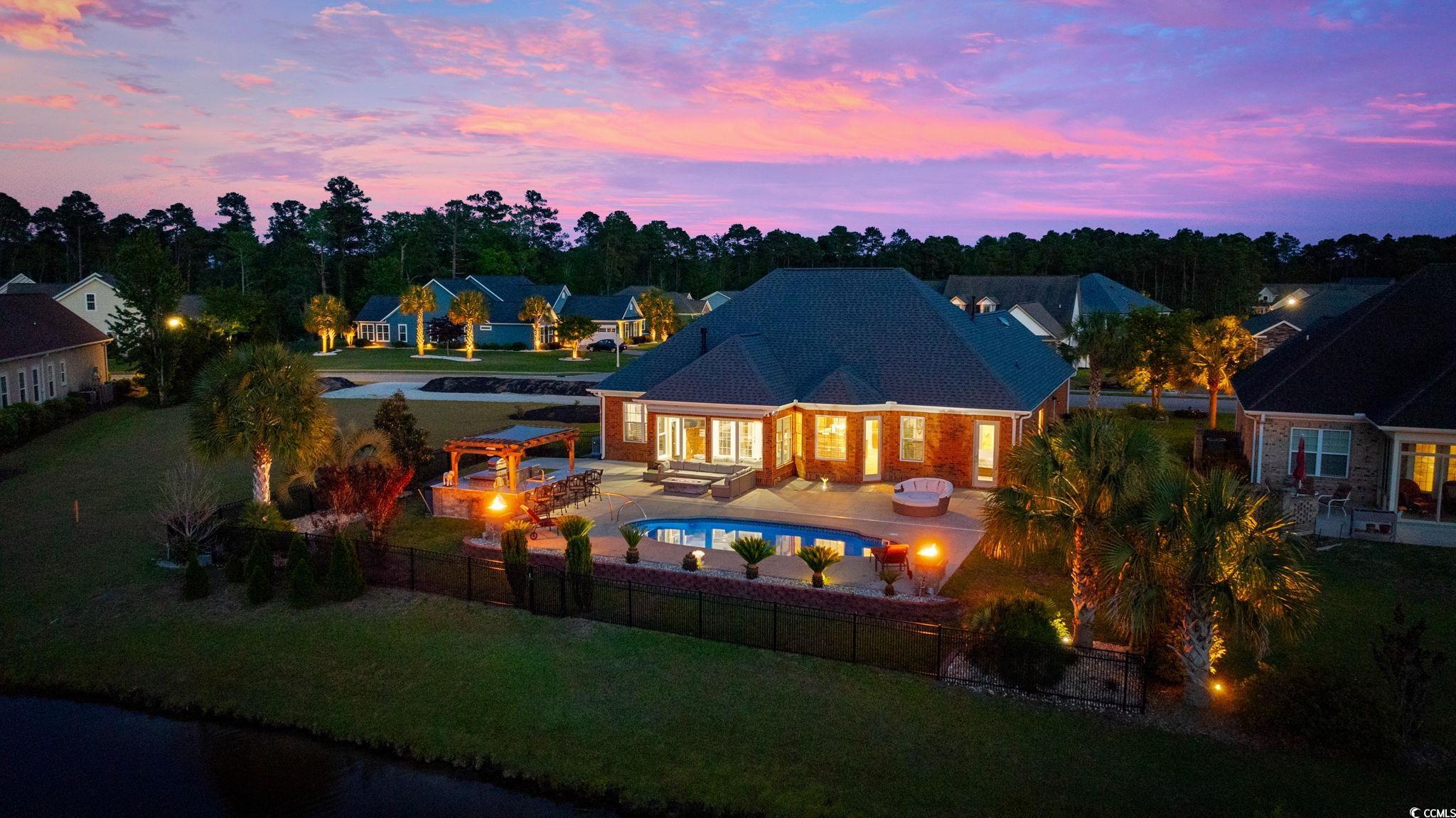 310 Babylon Pine Drive Myrtle Beach, SC 29579 - Photo 2 of 39 Back of house at dusk with an outdoor living space