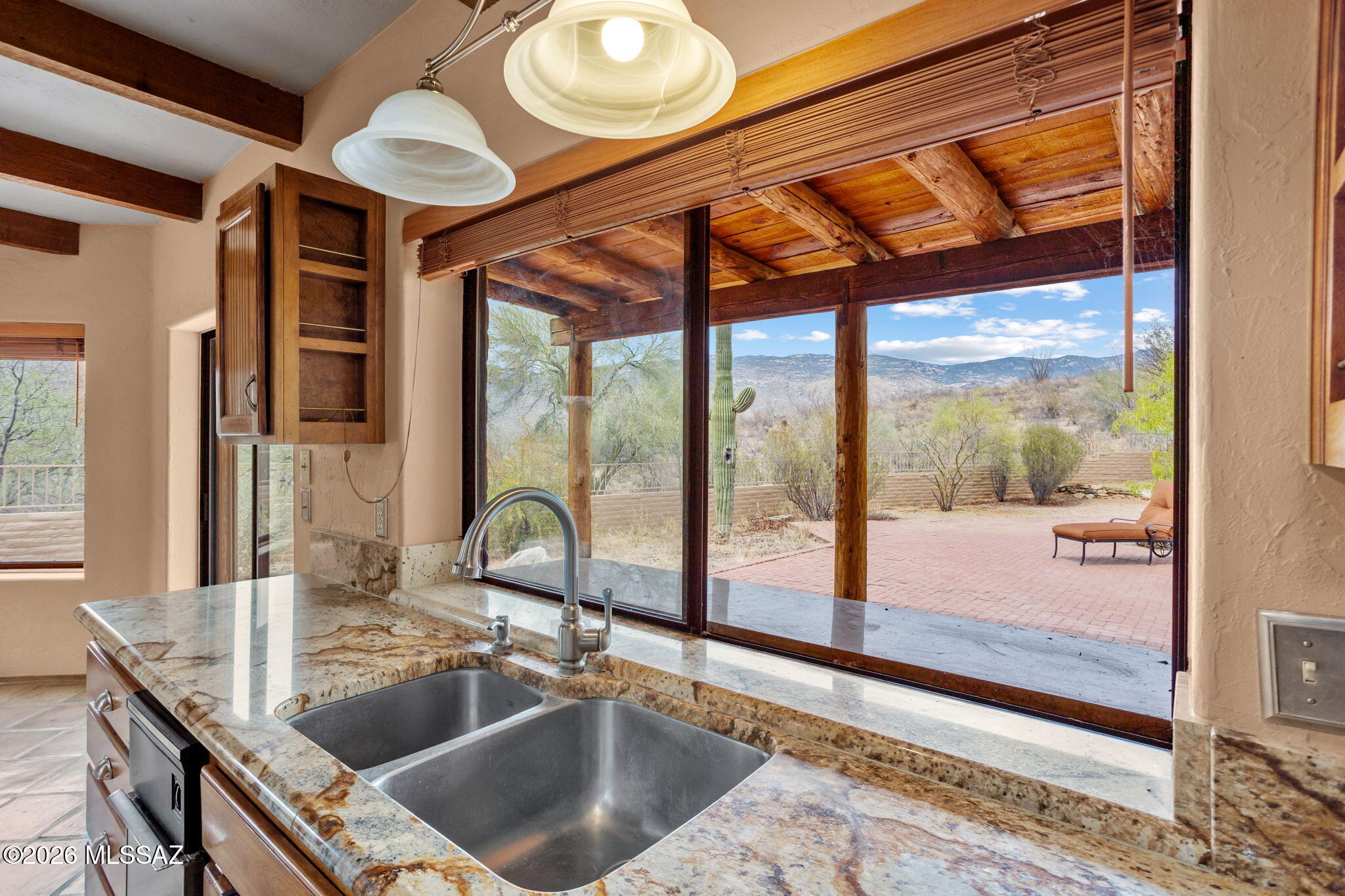 7171 South X9 Ranch Road Vail, AZ 85641 - Photo 32 of 50 Patio & mountain view from kitchen sink. Pass through window.