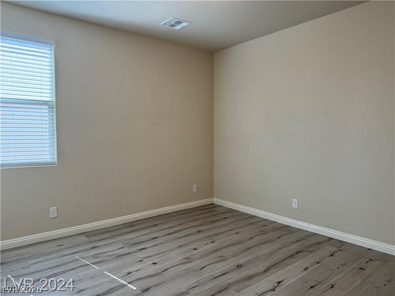 9056 Tony Ridge Avenue Las Vegas, NV 89148 - Photo 25 of 32 Laminate flooring offers durability and aesthetic appeal in this ready-to-personalize room.