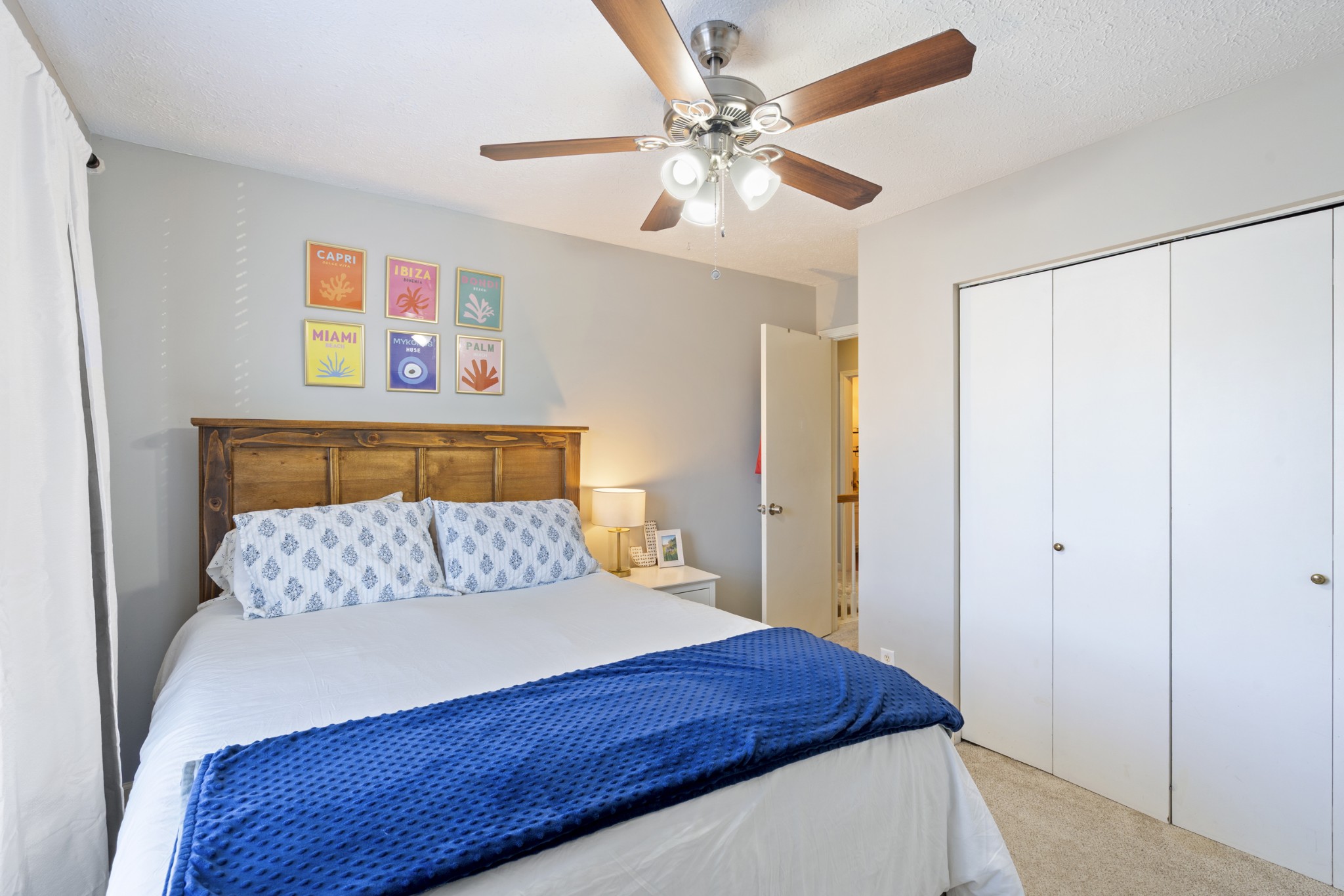 131 Deer Ridge Lane Hendersonville, TN 37075 - Photo 28 of 44 a bedroom with a bed and a chandelier