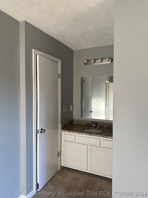 516 Jennings Farm Road Fayetteville, NC 28314 - Photo 11 of 17 a bathroom with a granite countertop sink and a mirror