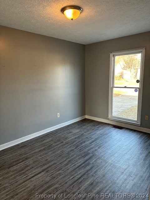 516 Jennings Farm Road Fayetteville, NC 28314 - Photo 8 of 17 an empty room with wooden floor and windows