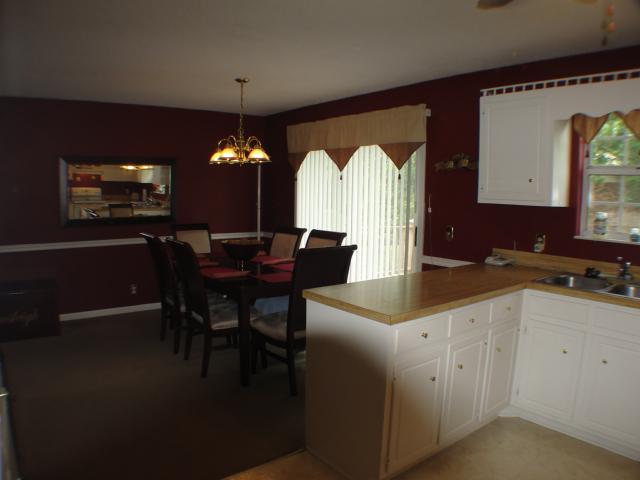 3445 New Towne Road Antioch, TN 37013 - Photo 4 of 14 a kitchen with a dining table chairs and a chandelier