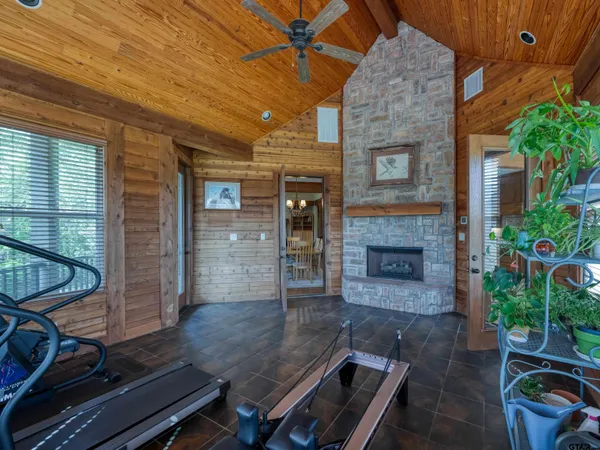 a room with wooden floor and a fireplace