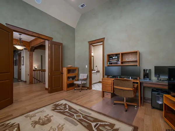 a workspace with furniture and wooden floor