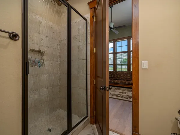 a bathroom with a shower and a sink